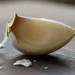 Throw a clove of garlic in the toilet before going to sleep: it’s amazing what happens.